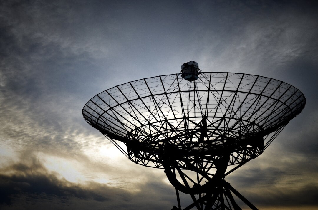 Antenna and satellite dish against the sky for live signal transmission
