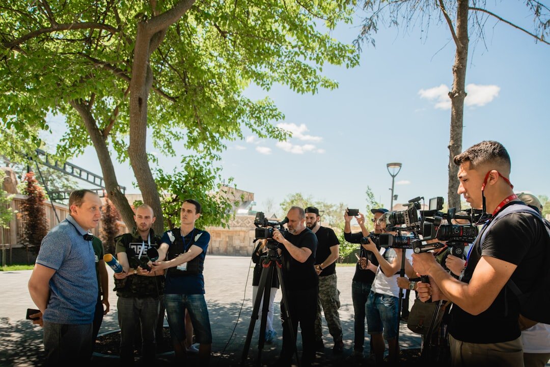 Diverse team of journalists and camera operators working together