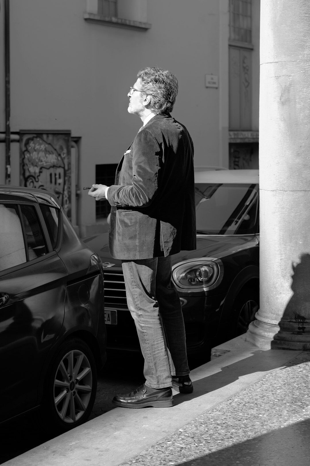 Journalist with microphone reporting in an urban street